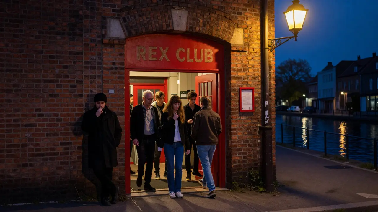 A red door with no sign in a quiet Paris street at midnight, a bouncer leaning against the wall as people enter quietly.