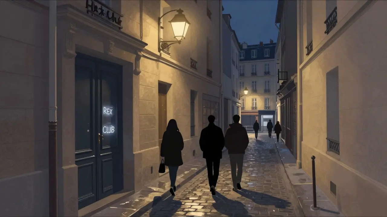 Rex Club’s unmarked entrance in a quiet Paris alley at night, wet pavement reflecting a single streetlamp.